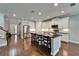 Modern kitchen with stainless steel appliances, white cabinetry, and a large center island at 11804 Harpswell Dr, Riverview, FL 33579