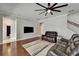 Comfortable living room with plush leather seating and a ceiling fan at 11804 Harpswell Dr, Riverview, FL 33579