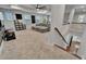 Second floor loft with media room, large windows, access to staircase, and modern ceiling fan at 11804 Harpswell Dr, Riverview, FL 33579
