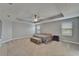 Bright, spacious main bedroom featuring a tray ceiling, neutral color palette, and ample natural light at 11804 Harpswell Dr, Riverview, FL 33579