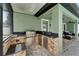 Outdoor kitchen with built-in grill and stainless steel storage for easy entertaining at 11804 Harpswell Dr, Riverview, FL 33579