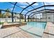 Relaxing screened-in pool with a spa and deck is perfect for entertaining or enjoying a quiet swim at 11804 Harpswell Dr, Riverview, FL 33579