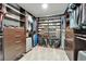 Organized walk-in closet with custom shelving, drawers, and ample storage space at 11804 Harpswell Dr, Riverview, FL 33579