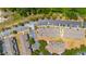 Aerial view of residences, parking, and natural green landscape provides a serene and spacious environment at 12805 Kings Crossing Dr, Gibsonton, FL 33534