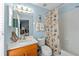 Comfortable bathroom with a shower-tub combination and nautical themed decorations at 12805 Kings Crossing Dr, Gibsonton, FL 33534