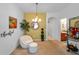Cozy dining room with stylish chandelier, accent wall, and elegant decor at 12805 Kings Crossing Dr, Gibsonton, FL 33534