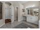 Large bathroom featuring a glass shower, double sinks, and a vanity area at 12902 Grand Traverse Dr, Dade City, FL 33525