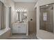 Bright bathroom featuring a glass shower, double sinks, and tile floor at 12902 Grand Traverse Dr, Dade City, FL 33525