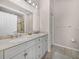 Bathroom with double sink vanity and tile floors at 12902 Grand Traverse Dr, Dade City, FL 33525