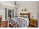 Bedroom with view and access to screened in pool area at 12902 Grand Traverse Dr, Dade City, FL 33525