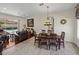Inviting dining area with views of the pool and seamless connection to the living room, blending style and comfort at 12902 Grand Traverse Dr, Dade City, FL 33525