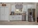 Functional kitchen design with stainless steel appliances, granite countertops, and ample storage space at 12902 Grand Traverse Dr, Dade City, FL 33525
