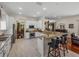 Bright kitchen boasts granite counters, breakfast bar and stainless steel appliances, blending style with functionality at 12902 Grand Traverse Dr, Dade City, FL 33525