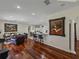Bright and open living space with hardwood floors, modern lighting and an open floor plan at 12902 Grand Traverse Dr, Dade City, FL 33525