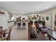 Open-concept living space featuring an eat-in kitchen, breakfast bar and living room with views to outdoors at 12902 Grand Traverse Dr, Dade City, FL 33525