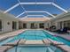 Enjoy the sun lounging by your private pool and spa on the back patio at 12902 Grand Traverse Dr, Dade City, FL 33525