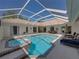 Pool and hot tub outside offer luxurious options for relaxation at 12902 Grand Traverse Dr, Dade City, FL 33525