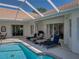 Lounge seating is available for entertaining, right beside the pool at 12902 Grand Traverse Dr, Dade City, FL 33525