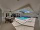 A stunning screened-in pool area with an attached spa, perfect for relaxation and entertaining at 12902 Grand Traverse Dr, Dade City, FL 33525