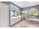 Bathroom features dual sinks, walk-in shower, and separate soaking tub at 12925 Tar Flower Dr, Tampa, FL 33626