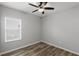 Neutral bedroom with modern ceiling fan and window for natural light at 12925 Tar Flower Dr, Tampa, FL 33626