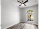 Light-filled bedroom boasts wood-look flooring and a large window with a view at 12925 Tar Flower Dr, Tampa, FL 33626