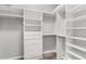 Organized walk-in closet with shelves, drawers, and hanging rods at 12925 Tar Flower Dr, Tampa, FL 33626