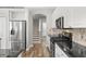 Modern kitchen with granite countertops, stainless steel appliances, and decorative tile backsplash at 12925 Tar Flower Dr, Tampa, FL 33626