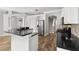 Updated kitchen with granite counters, stainless appliances, and hardwood floors at 12925 Tar Flower Dr, Tampa, FL 33626