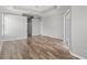 Bright living room boasts wood floors, slider access and neutral color palette at 12925 Tar Flower Dr, Tampa, FL 33626