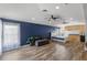Open living room with wood-look floors, ceiling fans, and ample space at 12925 Tar Flower Dr, Tampa, FL 33626