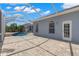 Spacious screened-in patio, perfect for outdoor entertaining with views of the pool and lush landscaping at 12925 Tar Flower Dr, Tampa, FL 33626