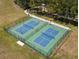 Aerial view of fenced pickleball courts, inviting residents to enjoy outdoor activities at 12925 Tar Flower Dr, Tampa, FL 33626
