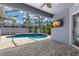 Screened-in pool and patio area with a beautiful view at 12925 Tar Flower Dr, Tampa, FL 33626