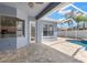 Covered patio with a view of the private pool and backyard at 12925 Tar Flower Dr, Tampa, FL 33626