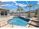An eye-level view of the screened-in pool, showcasing its design and the inviting backyard oasis at 12925 Tar Flower Dr, Tampa, FL 33626