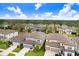 New construction community with well-maintained lawns and varied home designs, offering modern living at 14184 Samoa Hill Ct, Riverview, FL 33569