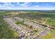 Areal view of a Gathering-friendly community with beautiful wooded areas, sidewalks, and convenient access to roadways at 14184 Samoa Hill Ct, Riverview, FL 33569