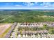 Areal view of a Primary-planned community near a beautiful wooded area with blue skies and scattered clouds at 14184 Samoa Hill Ct, Riverview, FL 33569
