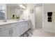 Bathroom showcasing double sinks, plenty of counter space and storage, with a decorative rug and plenty of light at 14184 Samoa Hill Ct, Riverview, FL 33569