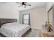 Bedroom features a neutral color palette, a ceiling fan, and a well-lit atmosphere from natural light at 14184 Samoa Hill Ct, Riverview, FL 33569