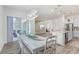 Open-concept dining area with stylish furnishings and seamless flow to the kitchen at 14184 Samoa Hill Ct, Riverview, FL 33569