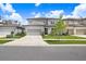 Attractive two-story home featuring a gray exterior, well-manicured lawn, and a two-car garage at 14184 Samoa Hill Ct, Riverview, FL 33569