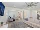Spacious living room with a large area rug, comfortable seating, and a view of the open floor plan at 14184 Samoa Hill Ct, Riverview, FL 33569