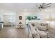 Spacious living room with a large sectional sofa and view to dining room at 14184 Samoa Hill Ct, Riverview, FL 33569