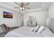 The main bedroom offers a tray ceiling with ceiling fan, chaise lounge, and a decorative display cabinet at 14184 Samoa Hill Ct, Riverview, FL 33569