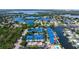 Picturesque aerial view of canal-front townhomes near waterways, and single Gathering homes at 1625 Watermark Ne Cir, St Petersburg, FL 33702