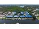 Aerial view of waterfront townhomes with private boat docks, offering a luxurious coastal community at 1625 Watermark Ne Cir, St Petersburg, FL 33702