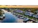 Stunning aerial view of waterfront homes with private docks and boats, nestled along a tranquil canal at 1625 Watermark Ne Cir, St Petersburg, FL 33702