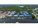 Aerial view of waterfront townhomes with private boat docks, offering a luxurious coastal community at 1625 Watermark Ne Cir, St Petersburg, FL 33702